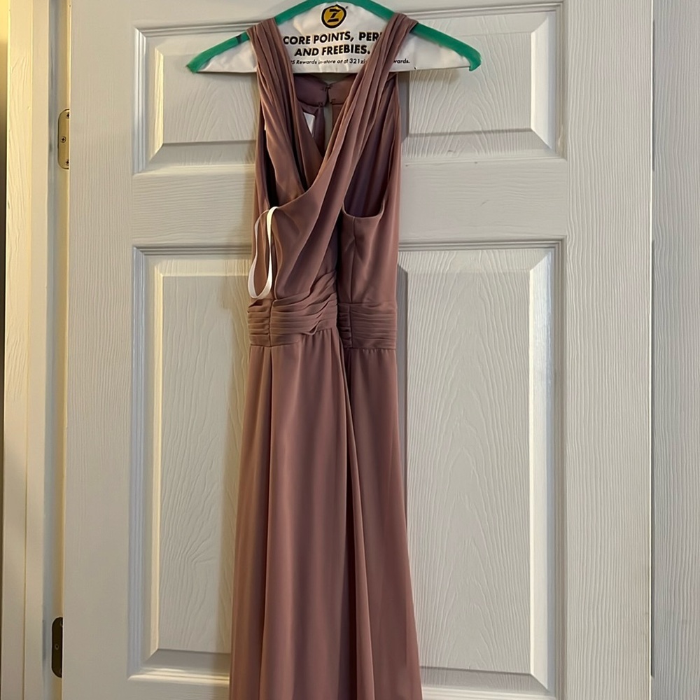 Bridesmaid dress or a wedding guest dress. It’s a mauve/purple color.